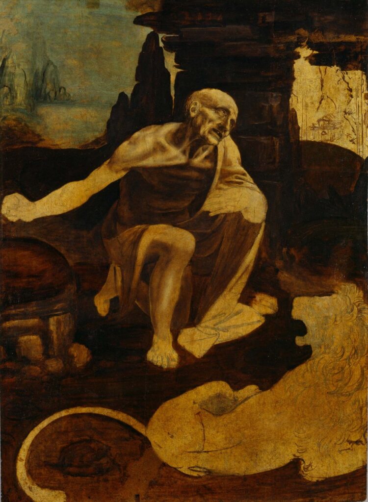 Pintura inacabada de São Jerônimo, de Leonardo da Vinci, retratando o santo em profunda meditação no deserto. A expressão intensa e o corpo esquelético mostram seu sofrimento e penitência, com um leão aos seus pés. A obra destaca o uso dramático da luz e da sombra.